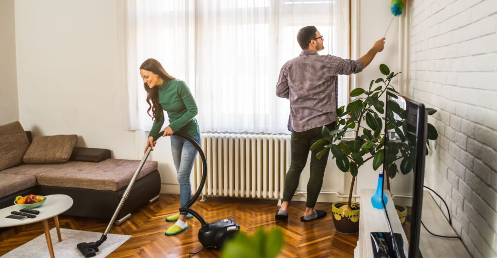 couple cleaning a room