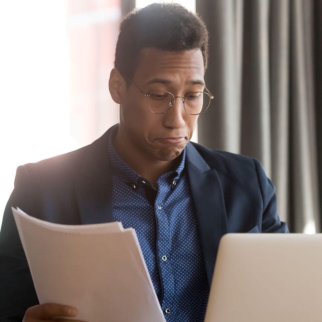 man reviewing paperwork