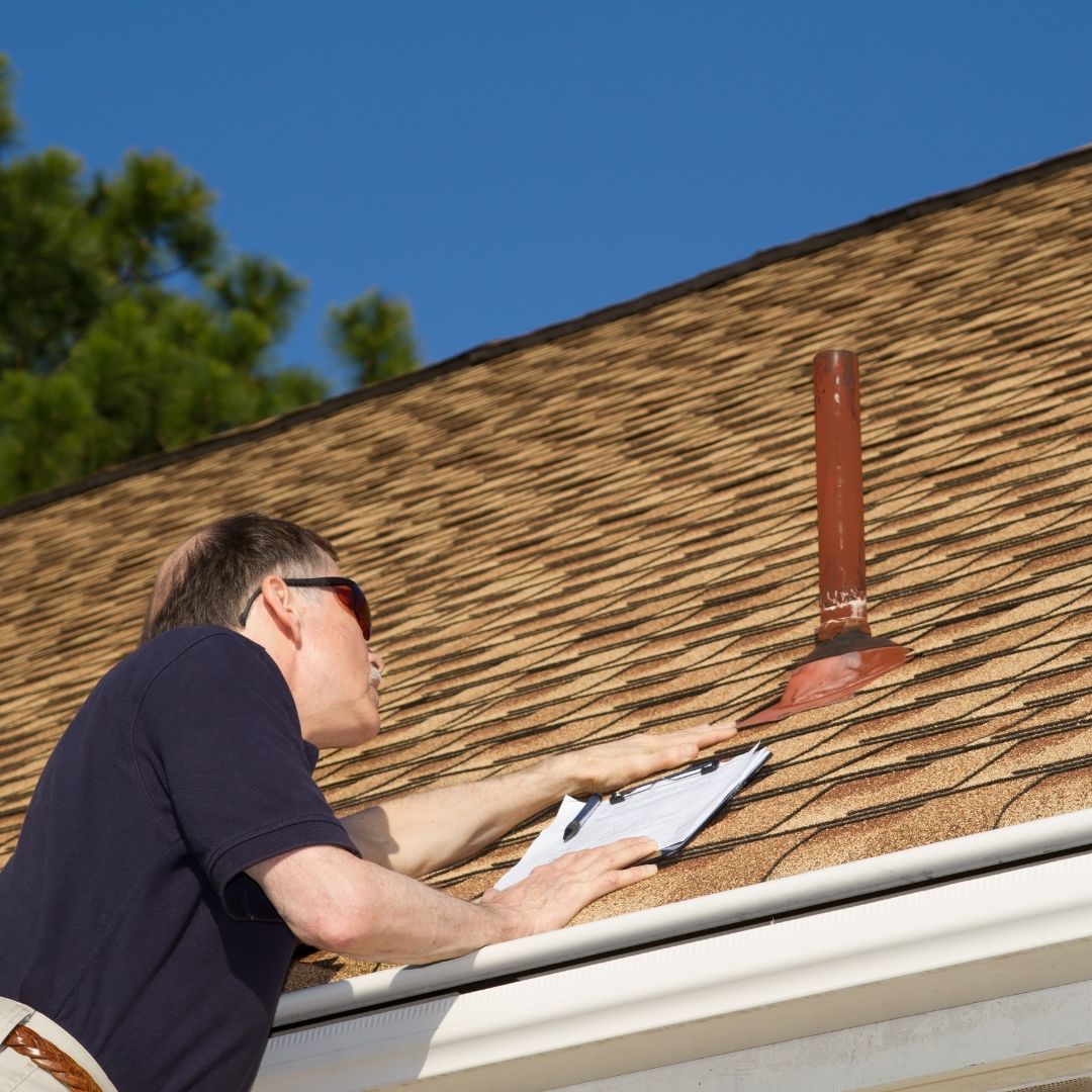 Home inspector on roof